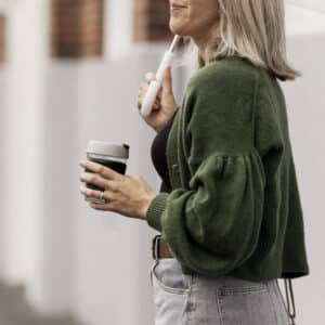 Woman wears green knitted Gather sleeve cardi