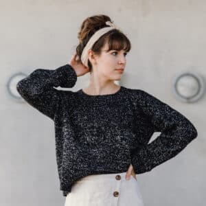 Woman wearing Black knitted simple sweater